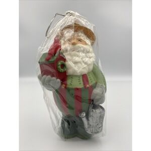 The White Barn Candle Co. Christmas Gardening Bird Loving Santa Candle 7"